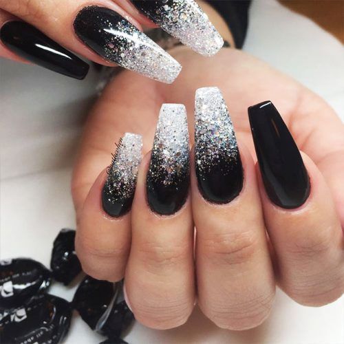 Black acrylic nail coffins with glitter