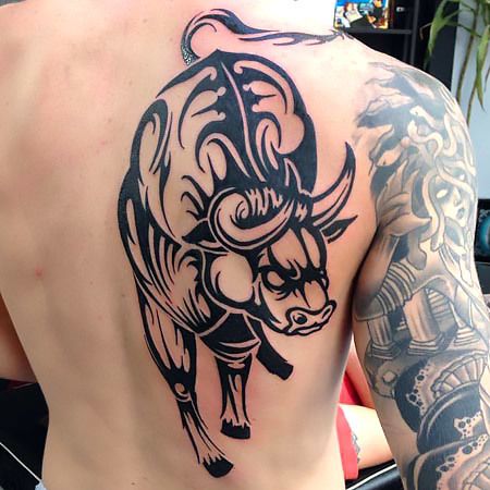 Black spine tattoos bull-inspired idea